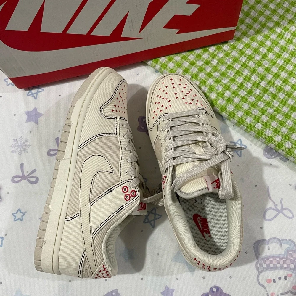 Nike Low-Top Sneakers in Cream with Red Details